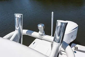 Slide: The Image of Manufacturer Provided Image: Close-up of 2020 Everglades 243 Center Console boat's rod holders and engine. - 13