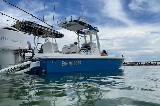 Slide: The Image of 2020 Everglades 243 Center Console boat on water, featuring Yamaha engine, under blue sky. - 17