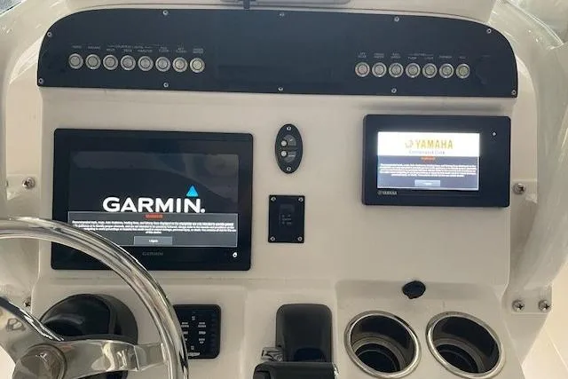 Slide: The Image of Center console of 2020 Everglades 243 with Garmin and Yamaha displays. - 22
