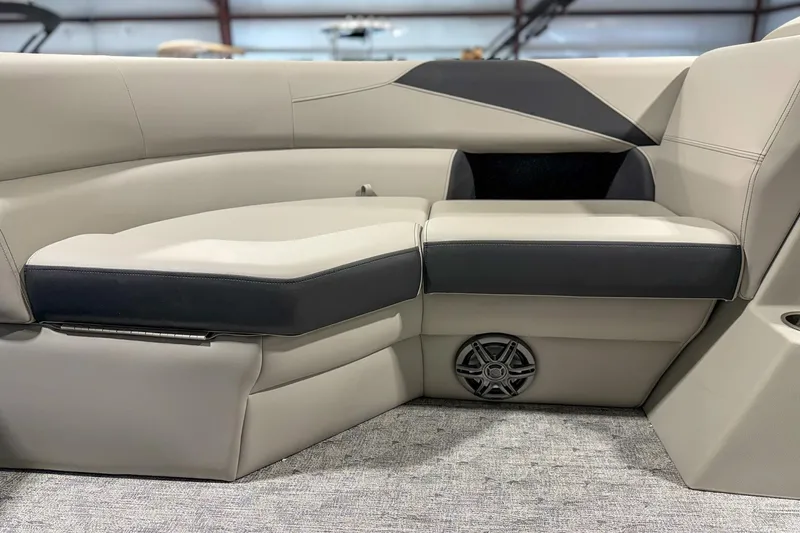 Slide: The Image of Luxurious seating in 2025 Trifecta 22 RF LE boat, featuring sleek design and integrated speaker. - 10