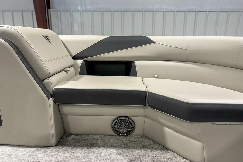 Slide: The Image of 2025 Trifecta 22 RF LE boat interior with sleek beige and black seating design. - 11