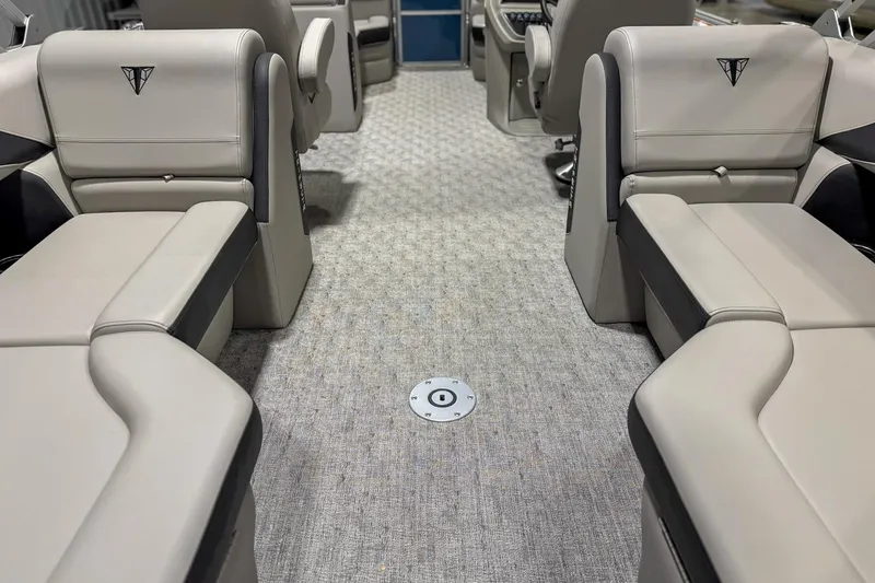 Slide: The Image of Interior of 2025 Trifecta 22 RF LE pontoon boat with beige seating and carpeted floor. - 12
