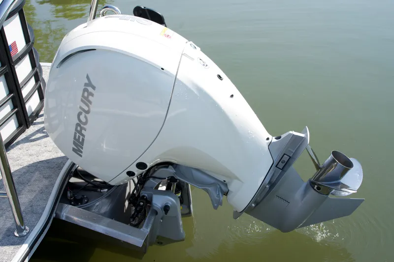 Slide: The Image of 2026 Berkshire 22 RFX LE with Mercury outboard motor on calm water. - 16