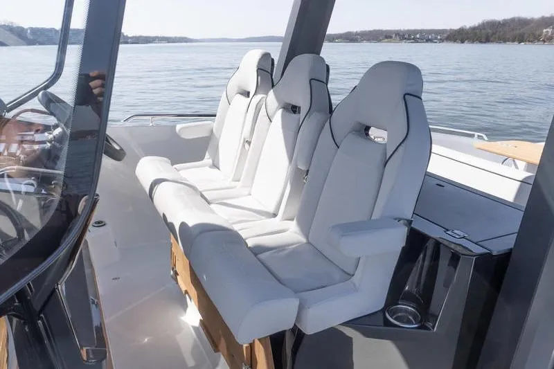 Slide: The Image of Interior seating of 2026 Beneteau Gran Turismo 35 yacht, featuring modern white seats. - 15