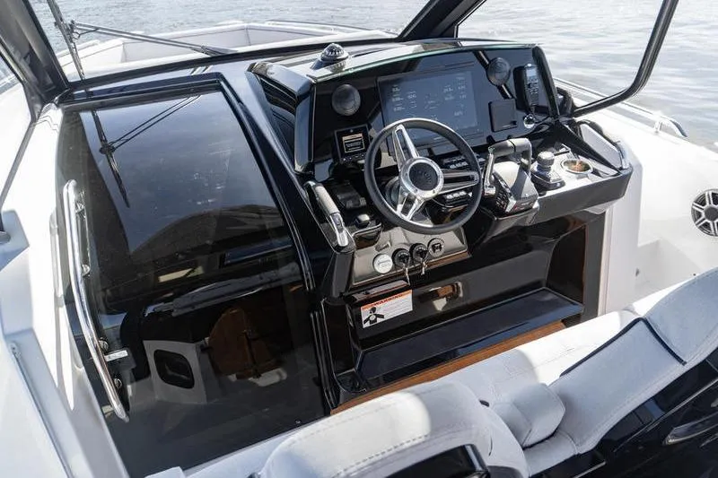 Slide: The Image of 2026 Beneteau Gran Turismo 35 cockpit with modern steering and navigation controls. - 17