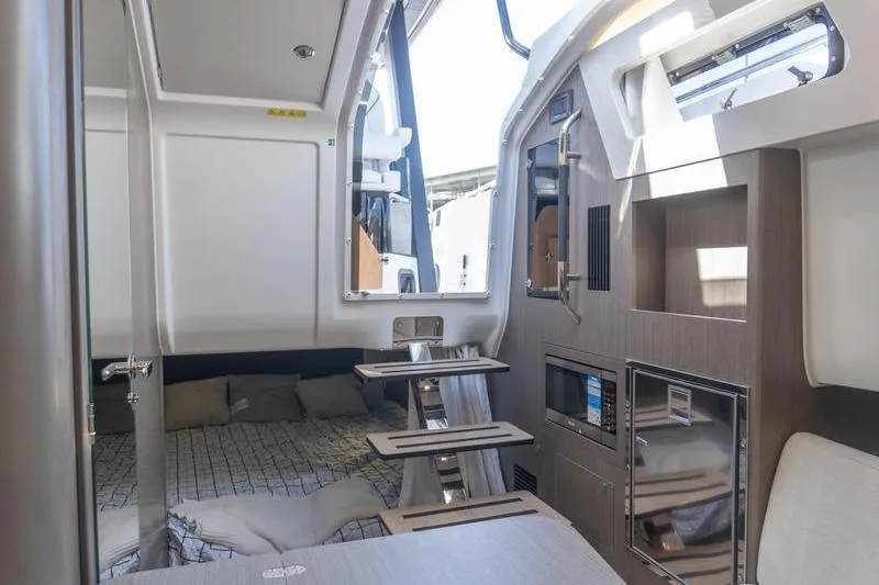 Slide: The Image of Interior of 2026 Beneteau Gran Turismo 35 yacht, featuring modern design and compact amenities. - 20