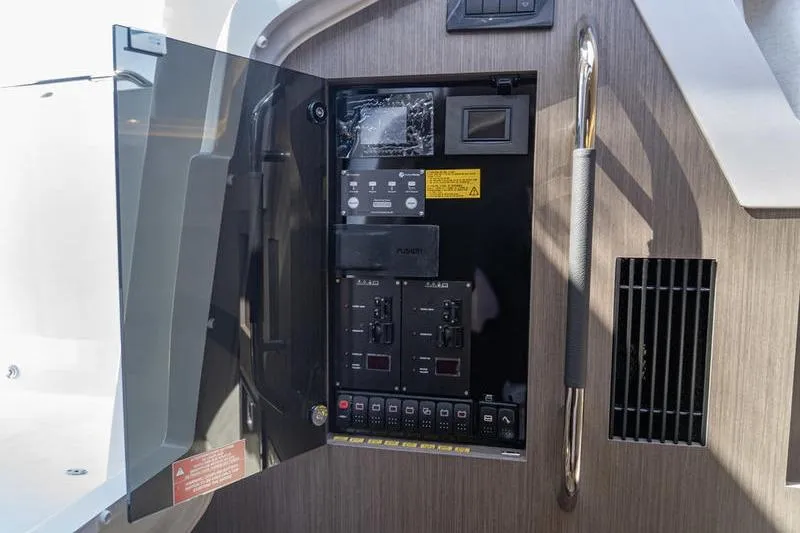Slide: The Image of Electrical panel inside 2026 Beneteau Gran Turismo 35 yacht, featuring control switches and indicators. - 21