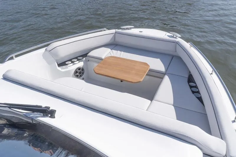 Slide: The Image of 2026 Beneteau Gran Turismo 35 yacht with spacious seating and wooden table on deck. - 24