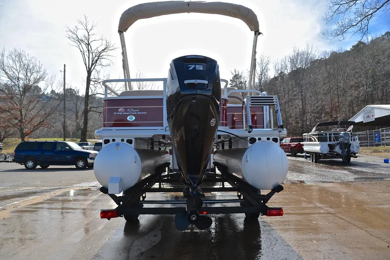 Slide: The Image of 2023 Sun Tracker Party Barge 18 DLX pontoon boat on trailer, rear view. - 13