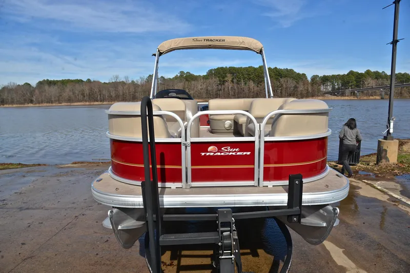 Slide: The Image of 2023 Sun Tracker Party Barge 18 DLX pontoon boat at lakeside launch. - 17