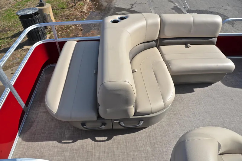 Slide: The Image of 2023 Sun Tracker Party Barge 18 DLX with beige seating and red railing. - 23