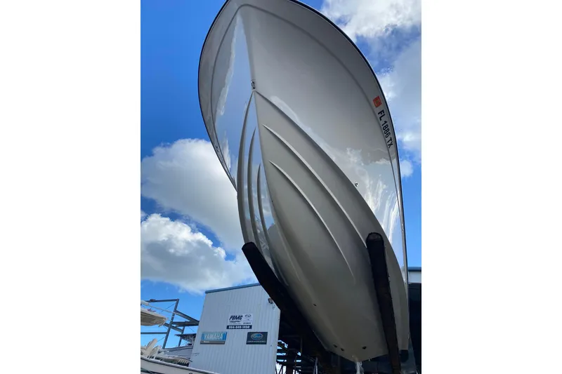 Slide: The Image of 2024 Grady-White Fisherman 257 boat hull against blue sky background. - 7