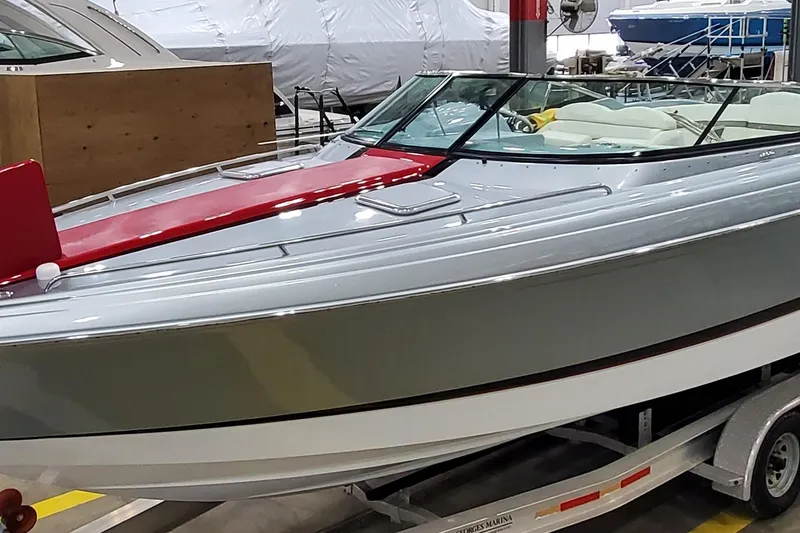 Slide: The Image of 2011 Formula 310 FX5 Bowrider boat on trailer in showroom. - 1