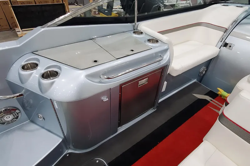 Slide: The Image of 2011 Formula 310 FX5 Bowrider interior with sink, cup holders, and seating. - 13