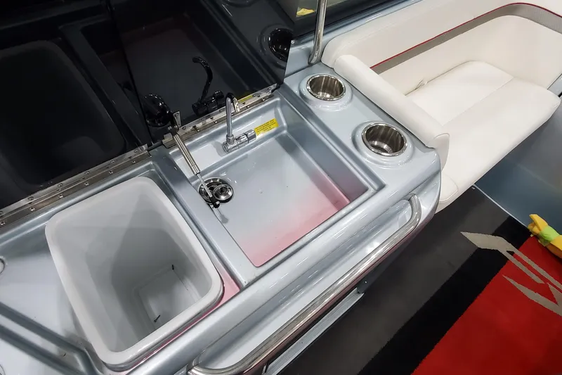 Slide: The Image of 2011 Formula 310 FX5 Bowrider interior with open mini fridge and control panel. - 14