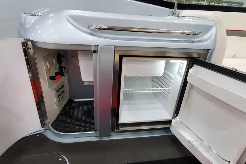 Slide: The Image of 2011 Formula 310 FX5 Bowrider interior with seating and sleek design features. - 15