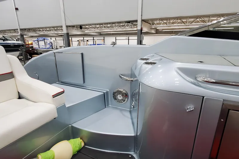 Slide: The Image of 2011 Formula 310 FX5 Bowrider dashboard with steering wheel and navigation instruments. - 16