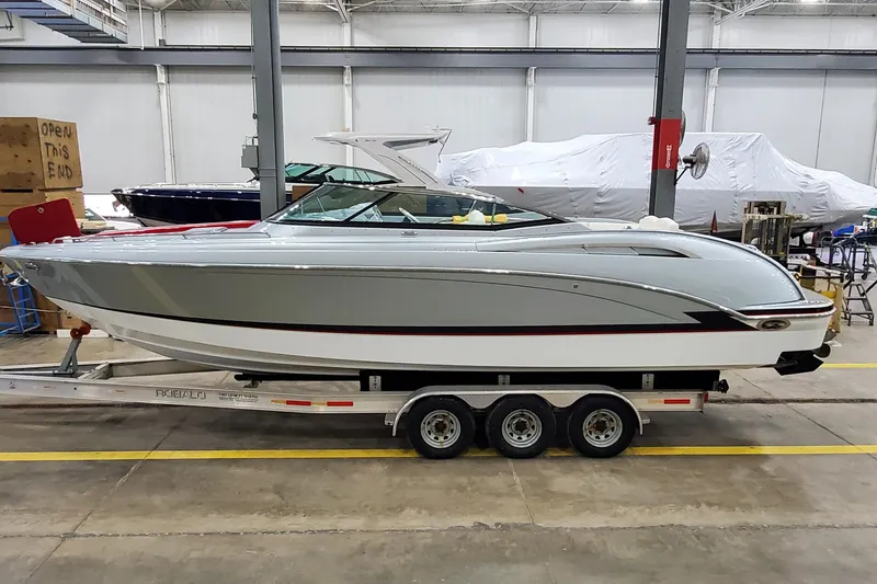 Slide: The Image of 2011 Formula 310 FX5 Bowrider on trailer in indoor storage facility. - 2