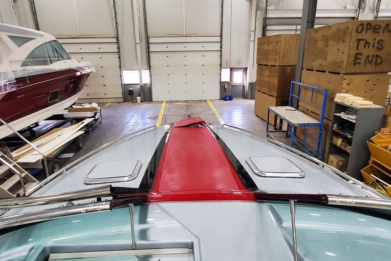 Slide: The Image of 2011 Formula 310 FX5 Bowrider interior with helm, gauges, and cabin entrance. - 21