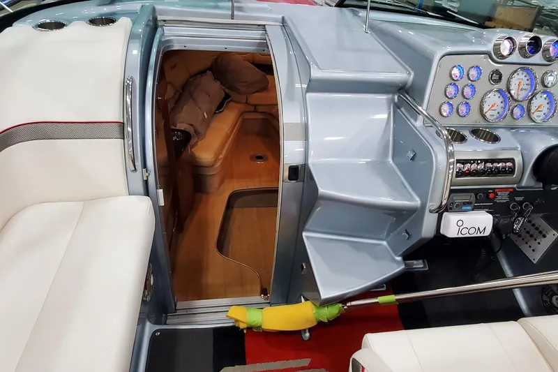 Slide: The Image of Interior of 2011 Formula 310 FX5 Bowrider with luxurious seating and wood finish. - 22