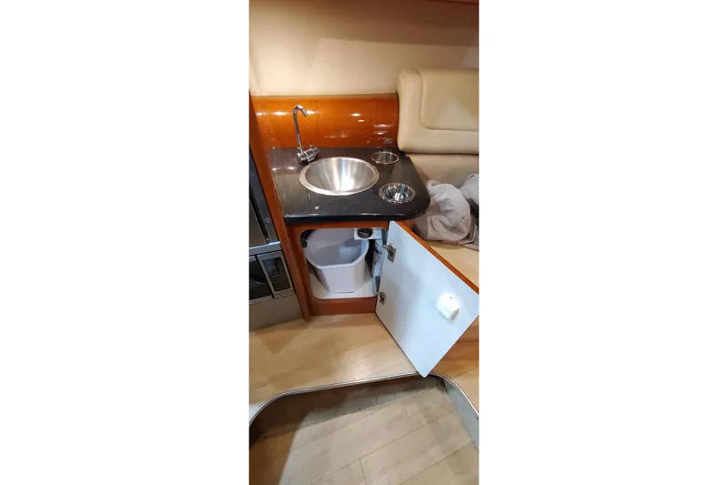 Slide: The Image of Interior view of 2011 Formula 310 FX5 Bowrider, featuring a wooden cabin door. - 24