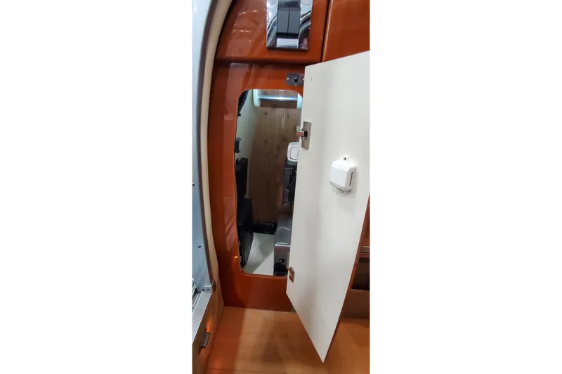 Slide: The Image of 2011 Formula 310 FX5 Bowrider interior with control panel and stainless steel fridge. - 25