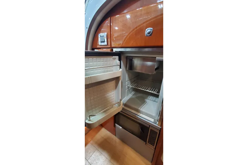 Slide: The Image of Interior storage space of 2011 Formula 310 FX5 Bowrider boat, featuring carpeted flooring. - 27