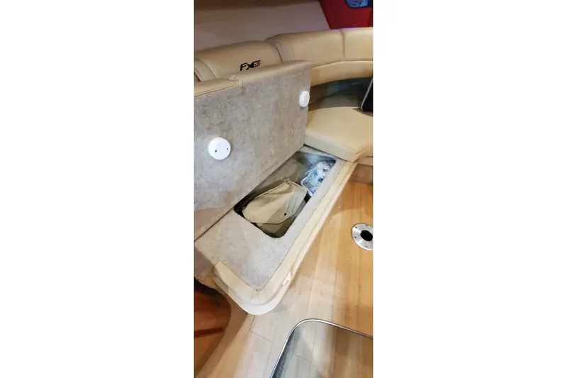 Slide: The Image of Luxurious interior of 2011 Formula 310 FX5 boat with plush seating and kitchenette. - 35