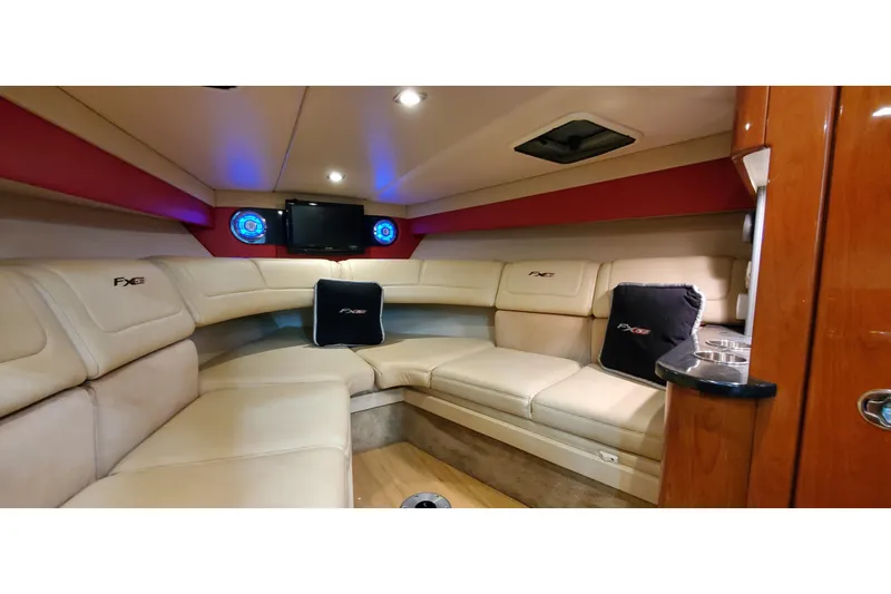 Slide: The Image of Luxurious interior of 2011 Formula 310 FX5 boat with plush seating and entertainment system. - 36