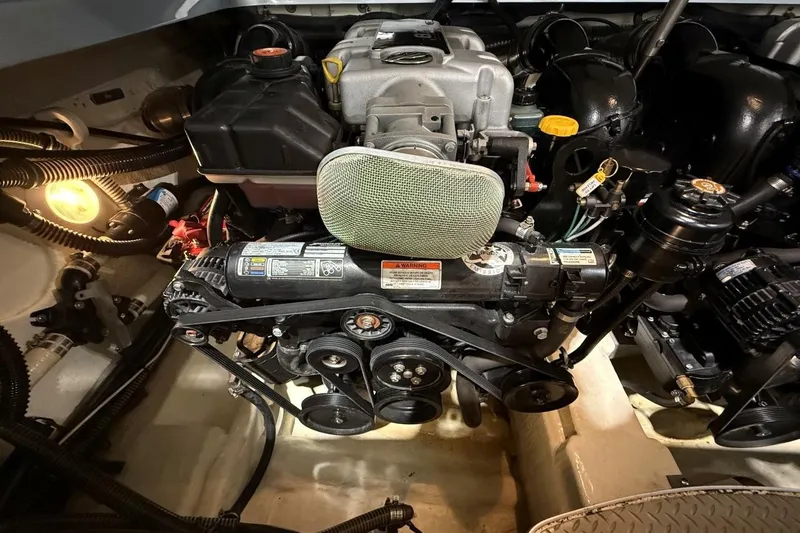 Slide: The Image of Engine compartment of a 2011 Formula 310 FX5 boat, showcasing mechanical components. - 39