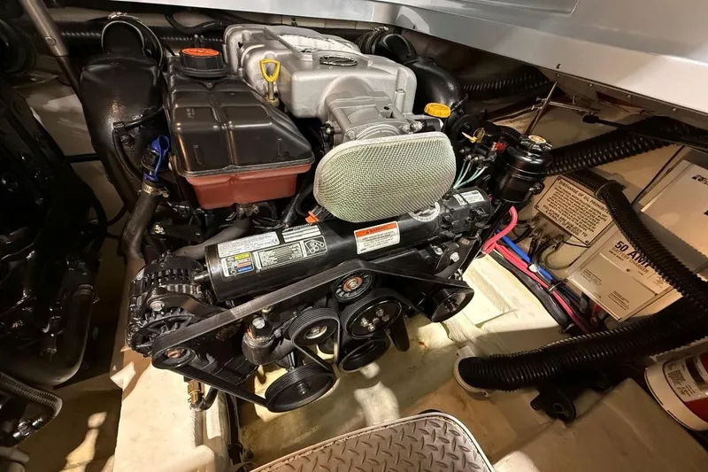 Slide: The Image of Engine compartment of a 2011 Formula 310 FX5 boat, showcasing detailed components. - 40