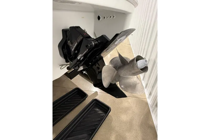 Slide: The Image of 2011 Formula 310 FX5 boat propeller and drive system in a storage facility. - 42