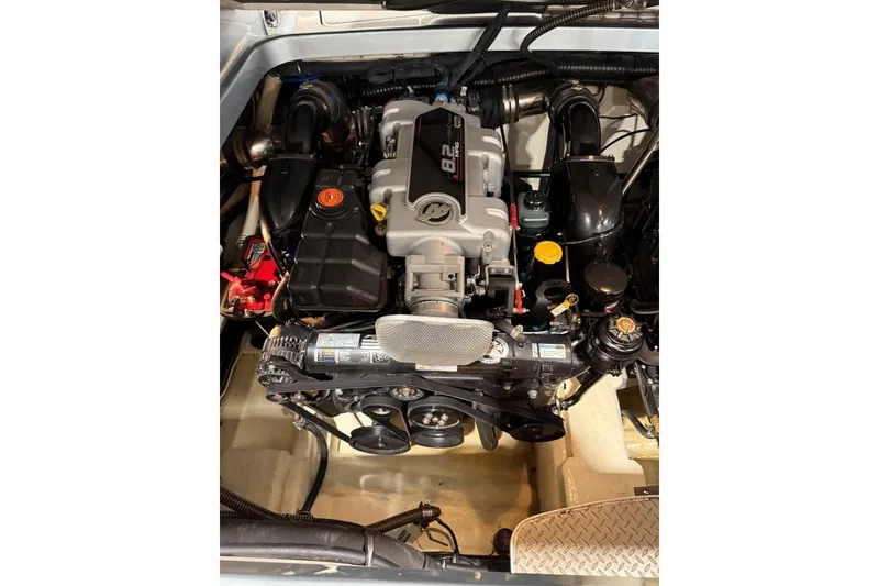 Slide: The Image of Engine of a 2011 Formula 310 FX5 boat, showcasing detailed components and layout. - 43