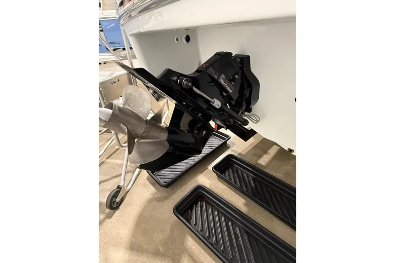 Slide: The Image of 2011 Formula 310 FX5 boat propeller and engine detail in showroom setting. - 44