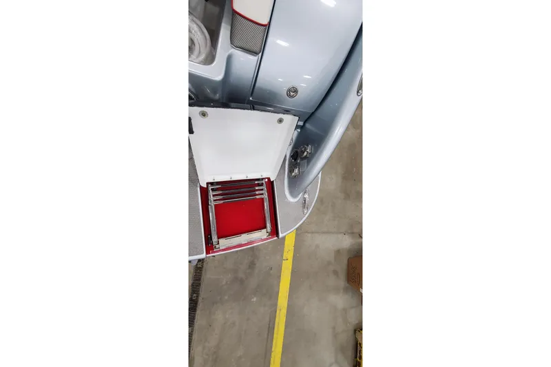 Slide: The Image of 2011 Formula 310 FX5 Bowrider interior view in a showroom setting. - 7