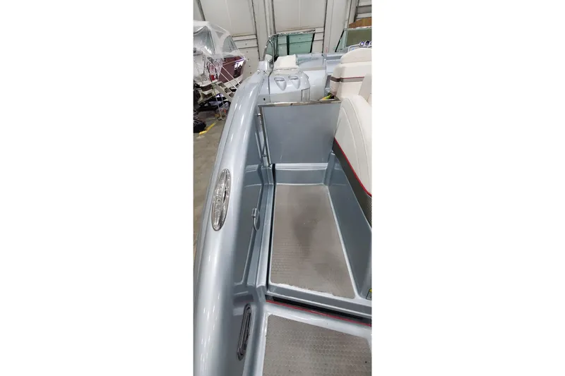 Slide: The Image of 2011 Formula 310 FX5 Bowrider interior with white seating and red accents. - 8