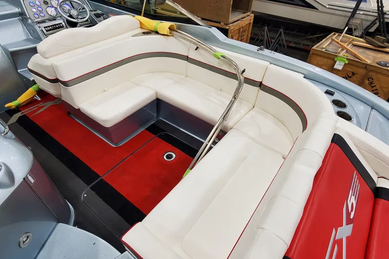 Slide: The Image of 2011 Formula 310 FX5 Bowrider interior with white seating and red accents. - 9