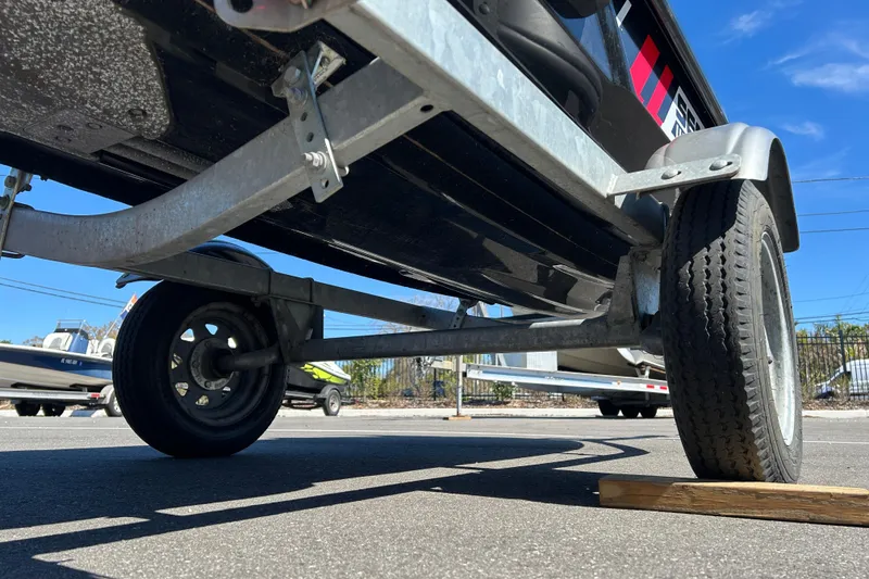 Slide: The Image of Trailer for 2012 Sea-Doo Wake 155, parked on asphalt with wooden block support. - 11