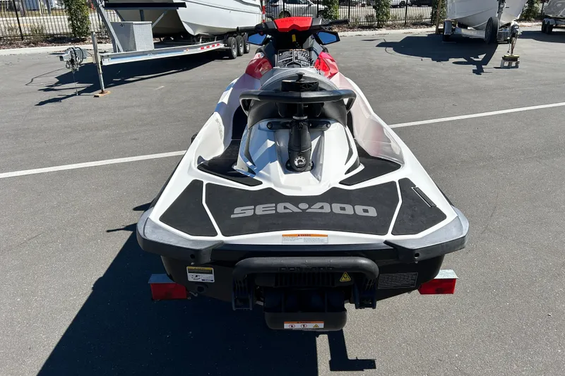 Slide: The Image of 2012 Sea-Doo Wake 155 jet ski on trailer, rear view in parking lot. - 3