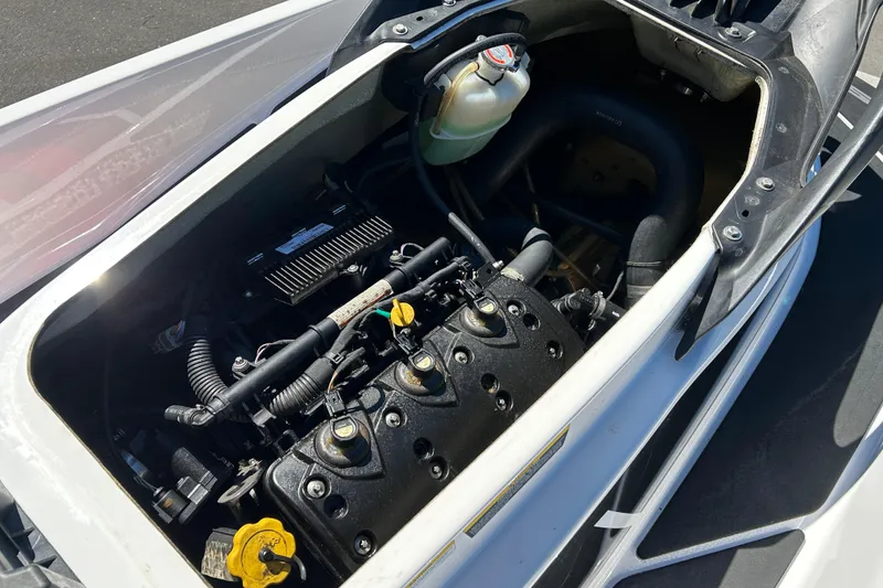 Slide: The Image of 2012 Sea-Doo Wake 155 engine compartment, showcasing internal components and design. - 6