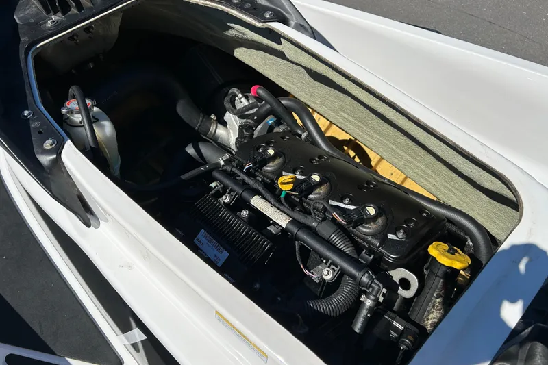 Slide: The Image of 2012 Sea-Doo Wake 155 engine compartment, showcasing internal components and design. - 7