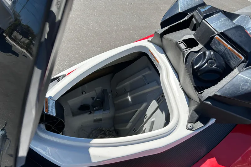 Slide: The Image of Open storage compartment of 2012 Sea-Doo Wake 155 jet ski, showing interior details. - 9