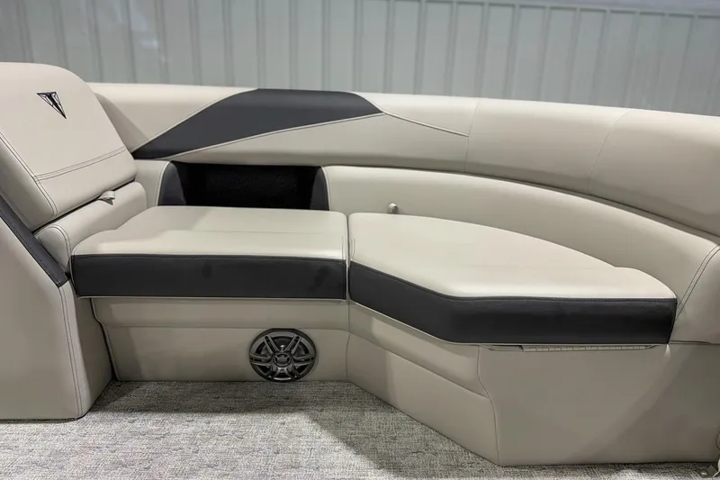 Slide: The Image of Luxurious seating in 2025 Trifecta 22RF LE pontoon boat, featuring sleek design and integrated speaker. - 11