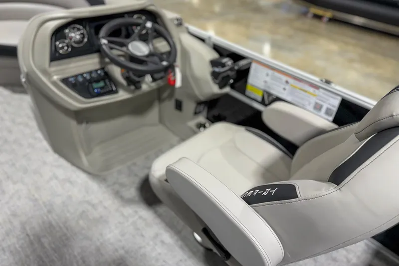 Slide: The Image of 2025 Trifecta 22RF LE boat interior with steering wheel and comfortable seating. - 8