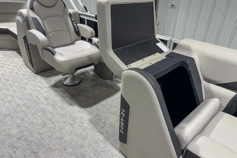 Slide: The Image of 2025 Trifecta 22RF LE boat interior with plush seating and storage compartments. - 9