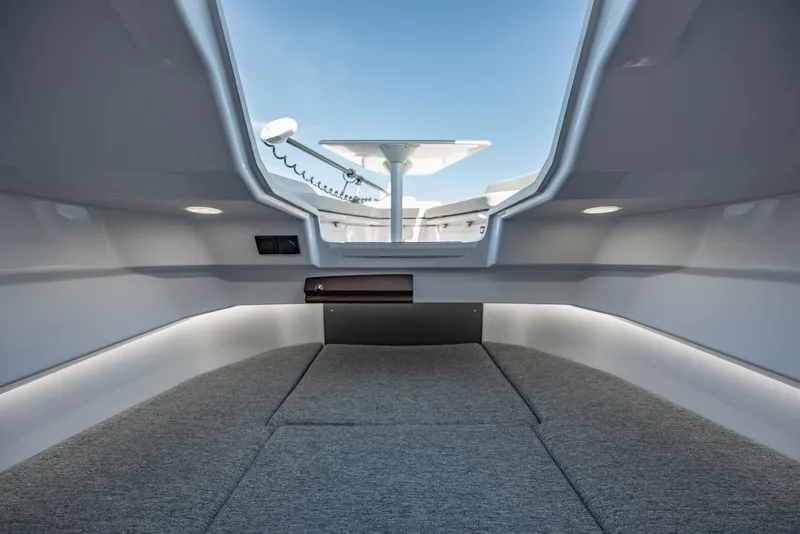 Slide: The Image of Interior cabin view of 2026 Axopar 29 CCX boat, featuring modern design and comfortable seating. - 16