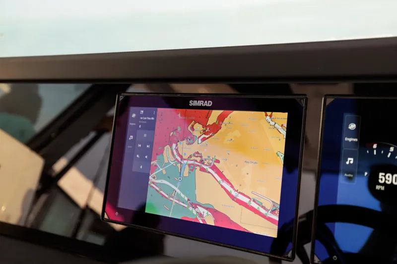 Slide: The Image of Simrad navigation display on 2026 Axopar 29 CCX boat dashboard. - 15