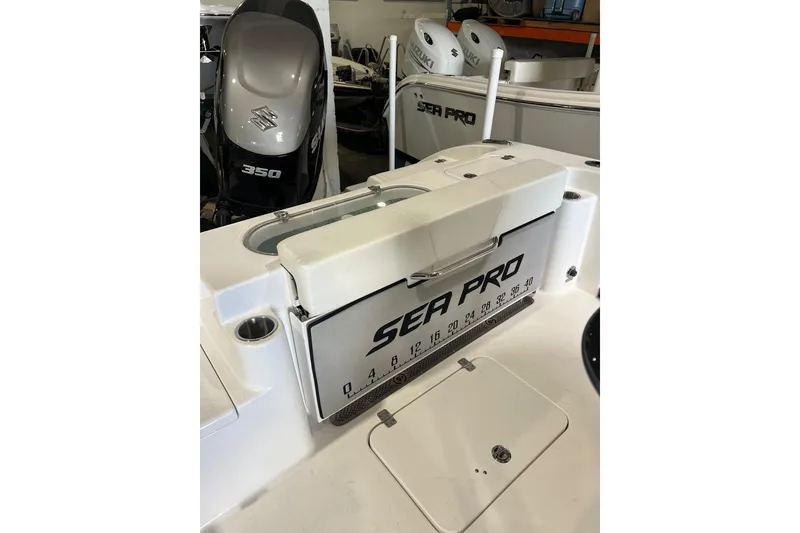 Slide: The Image of 2025 Sea Pro 242 Center Console boat with Suzuki 350 engine in showroom. - 3