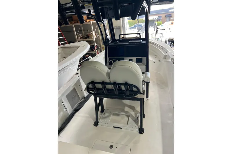 Slide: The Image of 2025 Sea Pro 242 Center Console boat interior with dual seating and console view. - 4