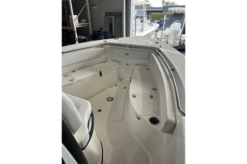 Slide: The Image of 2025 Sea Pro 242 Center Console boat interior, showcasing spacious seating and storage. - 8